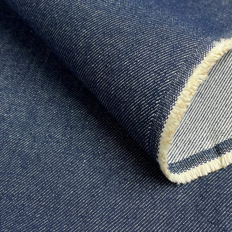 Close-up of denim fabric with a visible seam