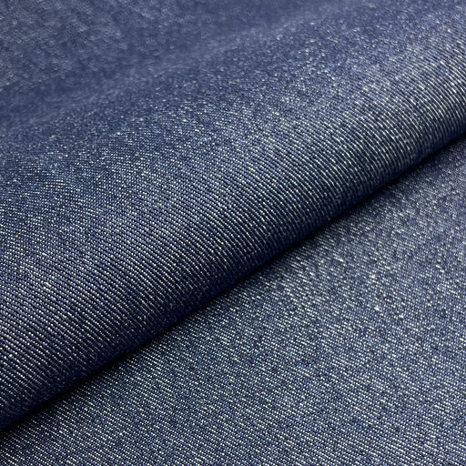 Close-up of blue denim fabric with a slight texture