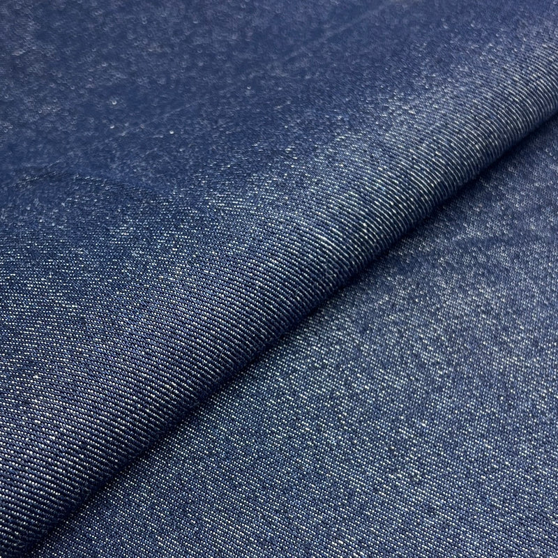 Close-up of blue denim fabric with a visible texture