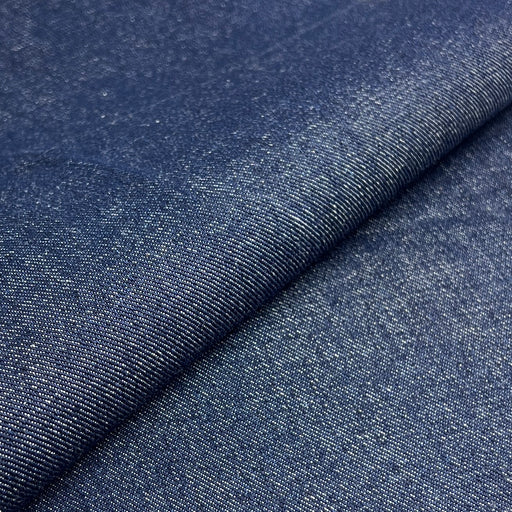Close-up of blue denim fabric with a visible texture