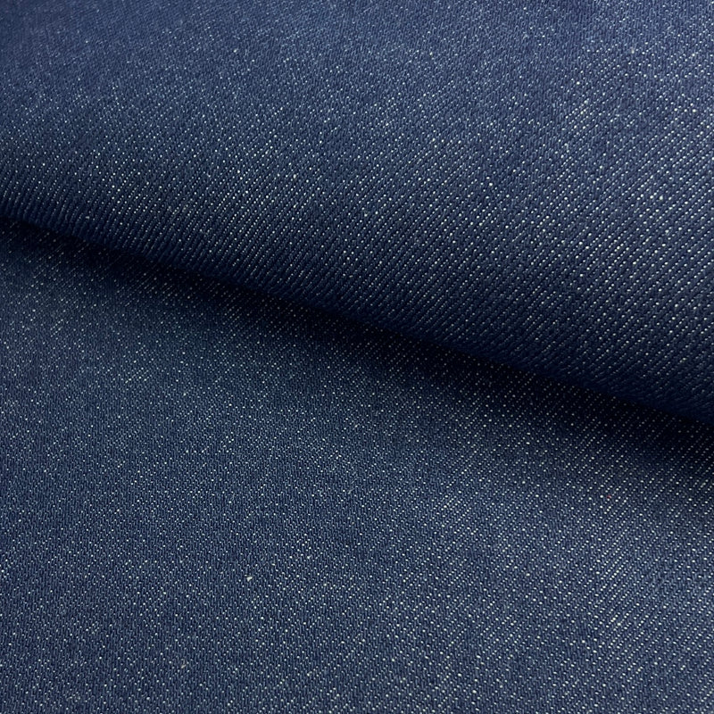 Close-up of dark blue denim fabric with a subtle texture.