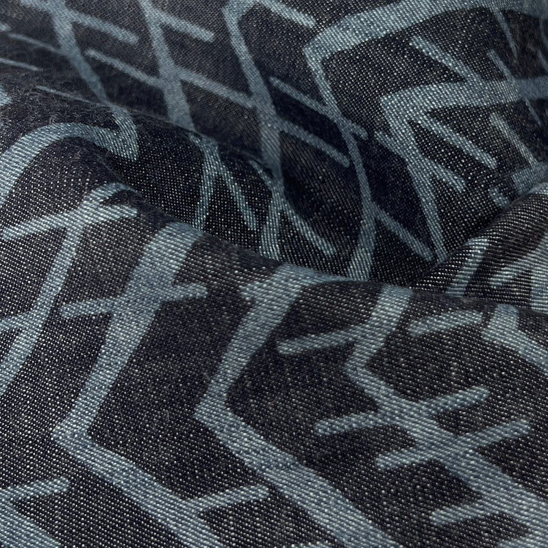 Closeup of lightweight tencel denim with geometric design print