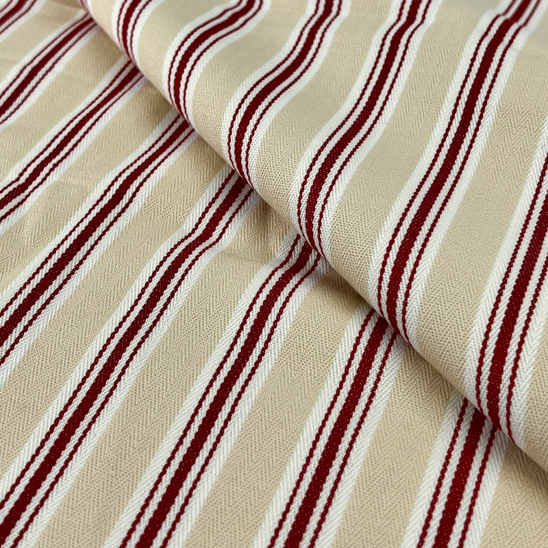 Close-up of beige fabric with red stripes