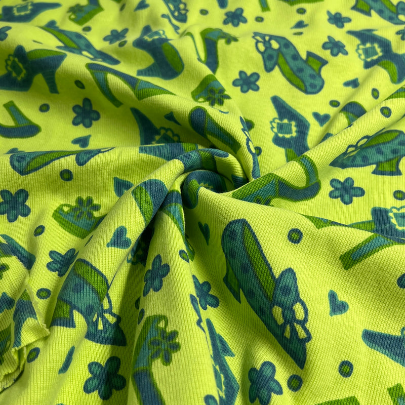 Green fabric with blue floral and leaf pattern