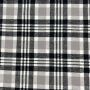Lightweight cotton flannel shirting fabric featuring a tartan plaid design of black, white & taupe.