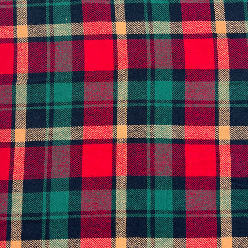 Lightweight flannel shirting fabric featuring a classic woven plaid design using christmas colors of green, red and gold. 