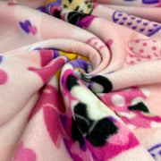 Close-up of colorful fleece fabric with cartoon character design