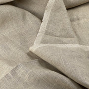 Close-up of beige fabric with a textured pattern