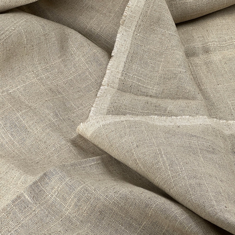 Close-up of beige fabric with a textured pattern