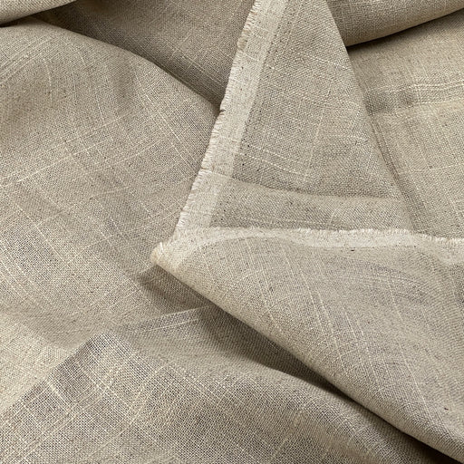 Close-up of beige fabric with a textured pattern