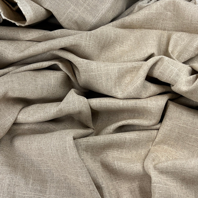 Close-up of beige fabric with a textured pattern