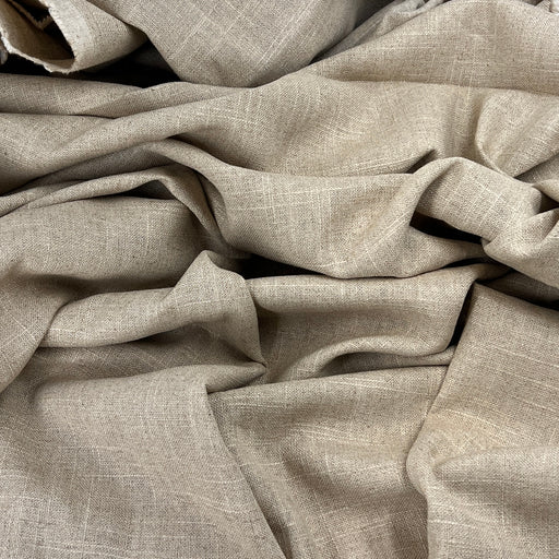 Close-up of beige fabric with a textured pattern