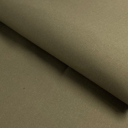 Close-up of olive green fabric with a slight texture
