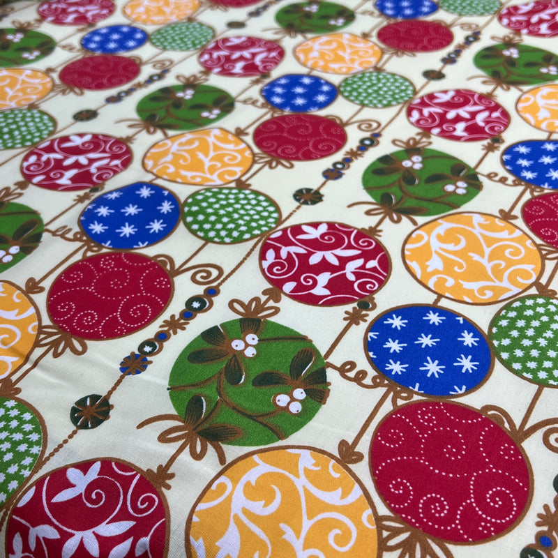Colorful patterned fabric with circular designs on a white background