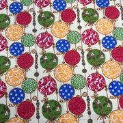 Patterned fabric with colorful circles and decorative elements on a white background