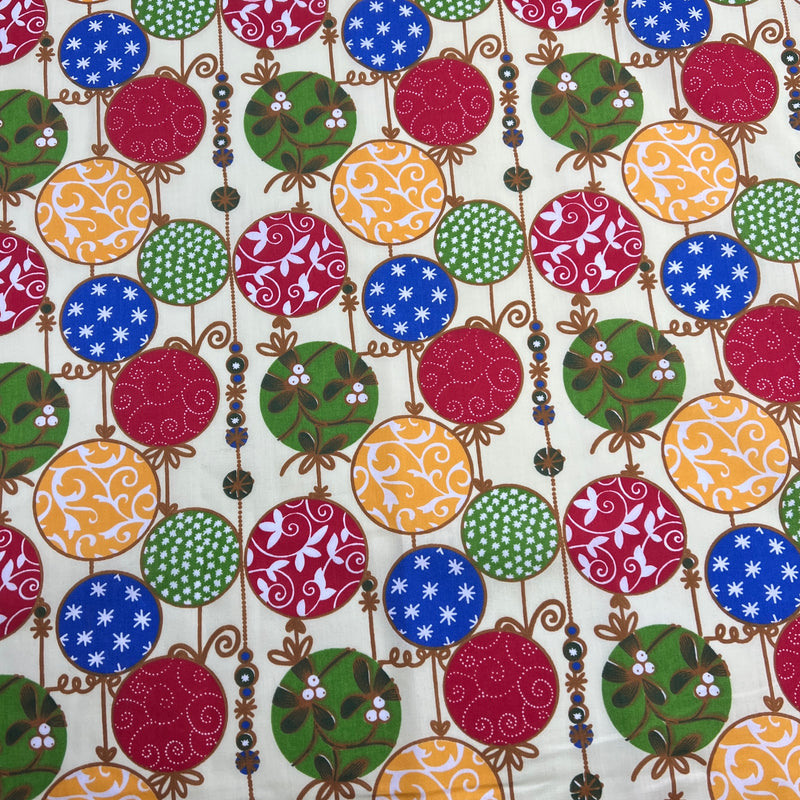 Patterned fabric with colorful circles and decorative elements on a white background