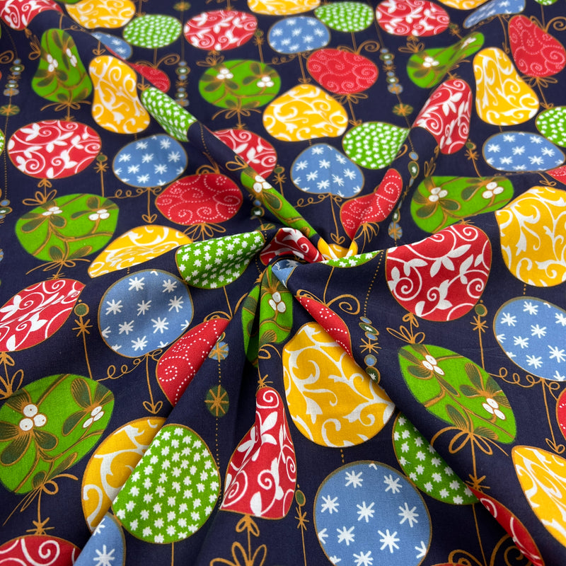 Colorful fabric pattern with balloons on a dark blue background