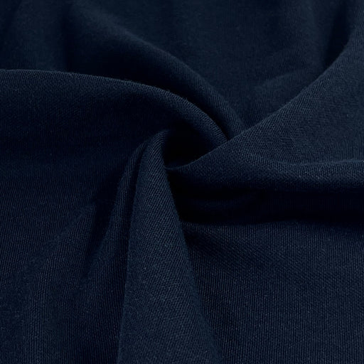 Deep, rich navy colored polyester/acrylic/cotton jersey knit ideal for long sleeves and lightweight sweaters. 