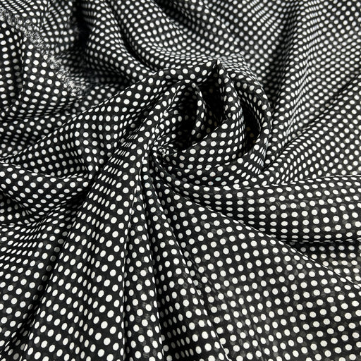 Black fabric with white polka dots