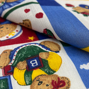Close-up of fabric with teddy bear and pie pattern