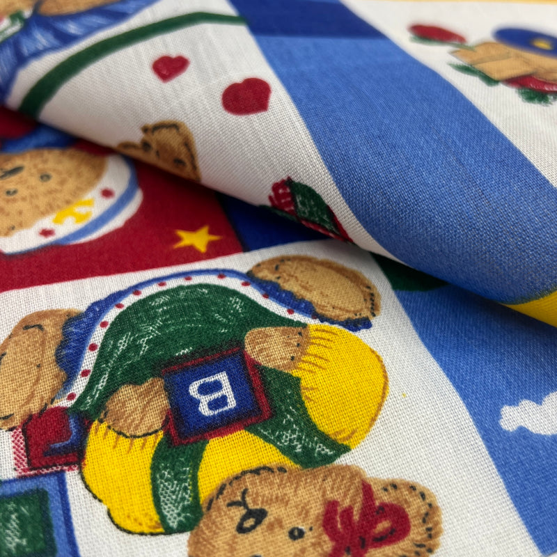 Close-up of fabric with teddy bear and pie pattern