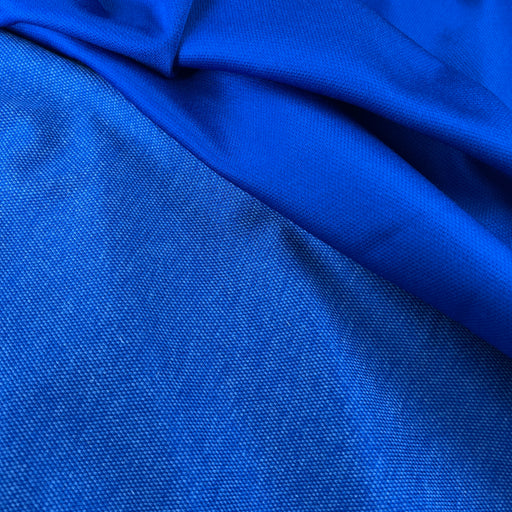 Close-up of blue fabric with a textured pattern