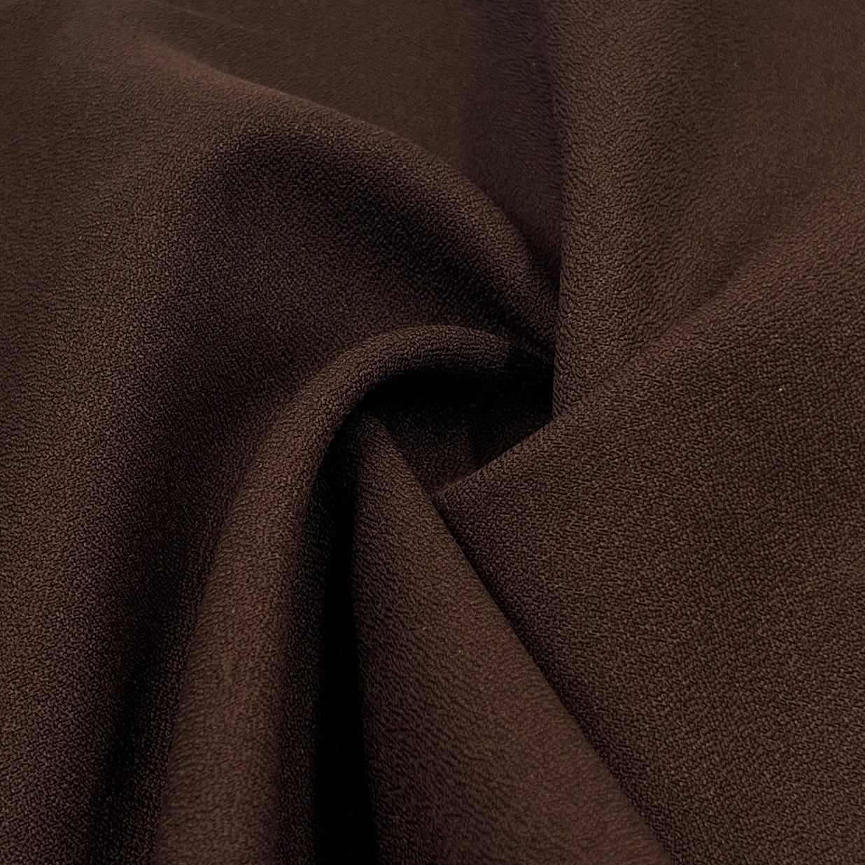 Close-up of brown fabric with a textured surface
