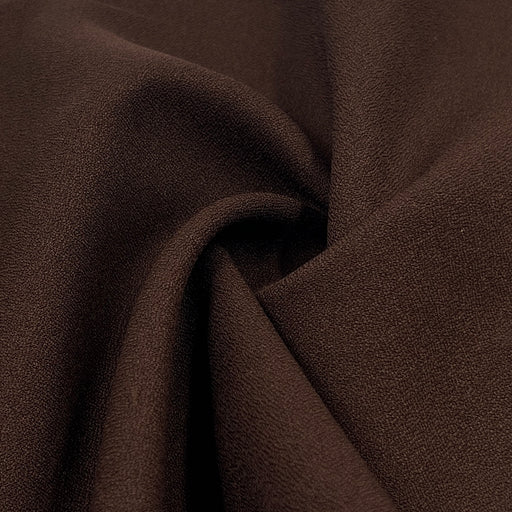 Close-up of brown fabric with a textured surface
