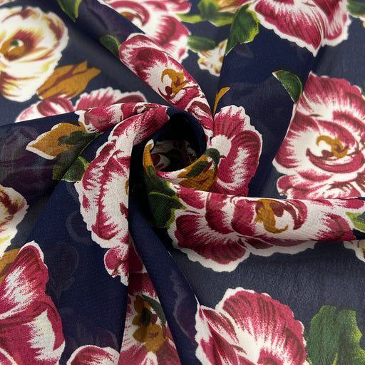 Floral fabric with pink and white flowers on a navy background