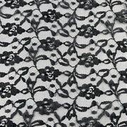 Black floral lace pattern on a white background
