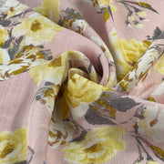 Close-up of floral rayon faux-linen fabric with yellow flowers on a pink background
