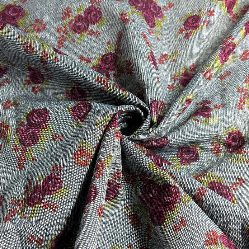 Floral patterned fabric with purple roses on a gray background