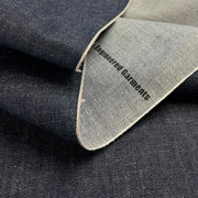 Close-up of denim fabric with 'Engineered Garments' label