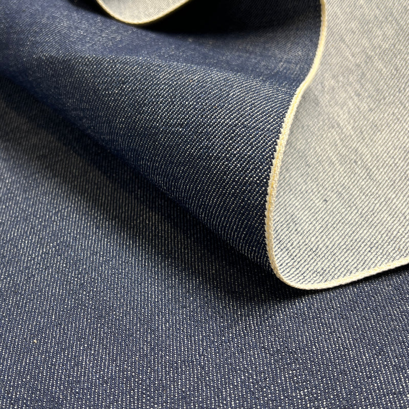 Close-up of denim fabric with a visible closed selvedge edge