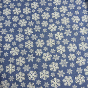 Pattern of white snowflakes on a blue background