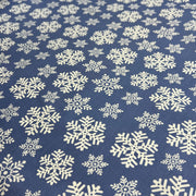 Pattern of white snowflakes on a blue background