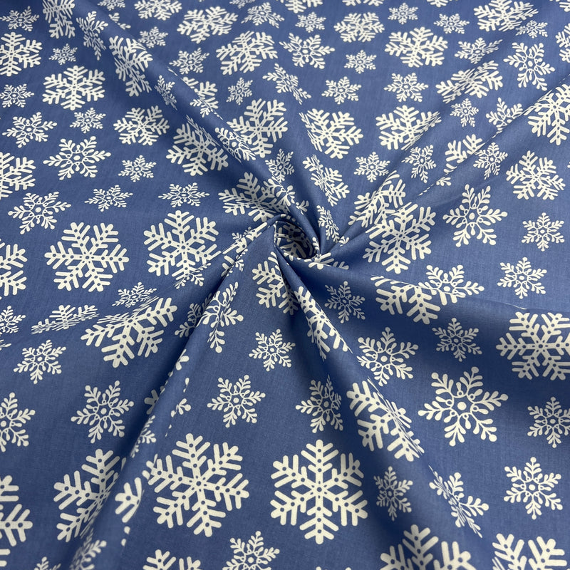 Blue fabric with white snowflake pattern