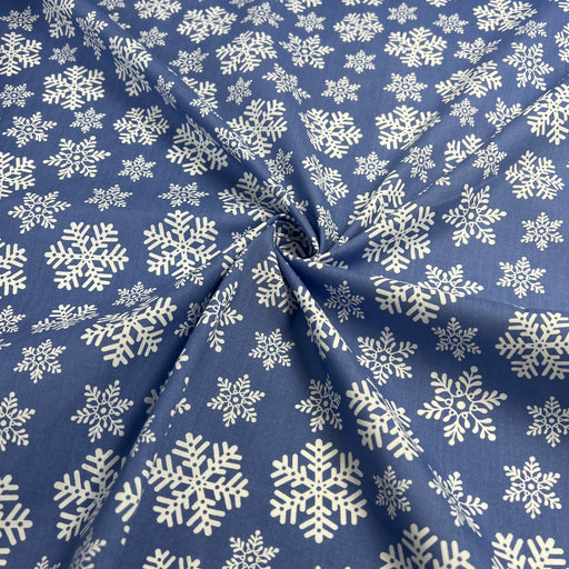 Blue fabric with white snowflake pattern