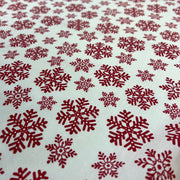 Red snowflake pattern on a white background