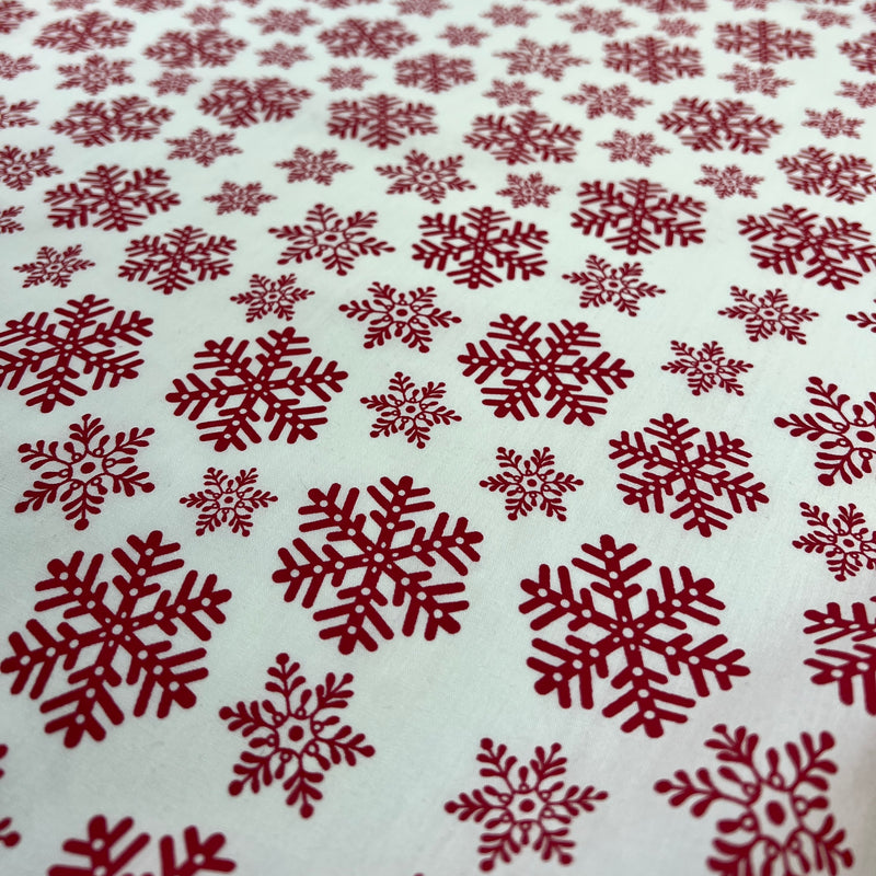 Red snowflake pattern on a white background
