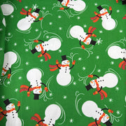 Pattern of snowmen with scarves on a green background