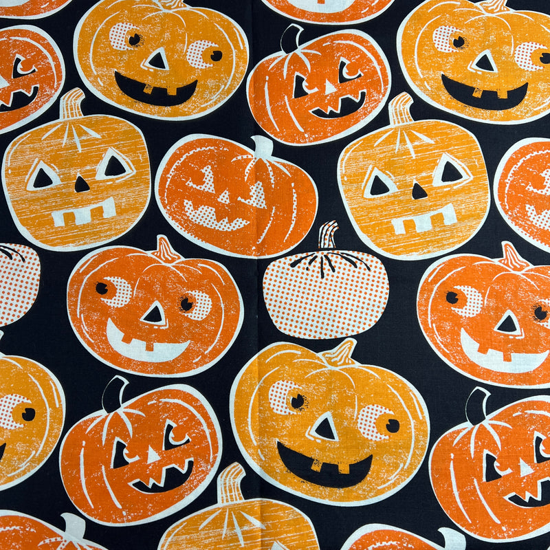 Pattern of jack-o'-lanterns on a black background