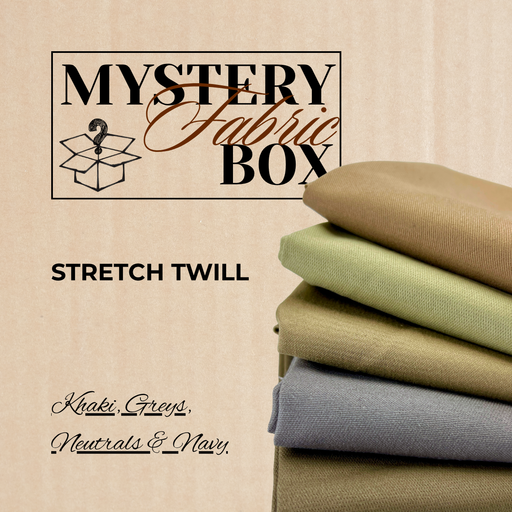Stack of folded fabric swatches labeled 'Mystery Fabric Box' with 'Stretch Twill' description on a beige background.