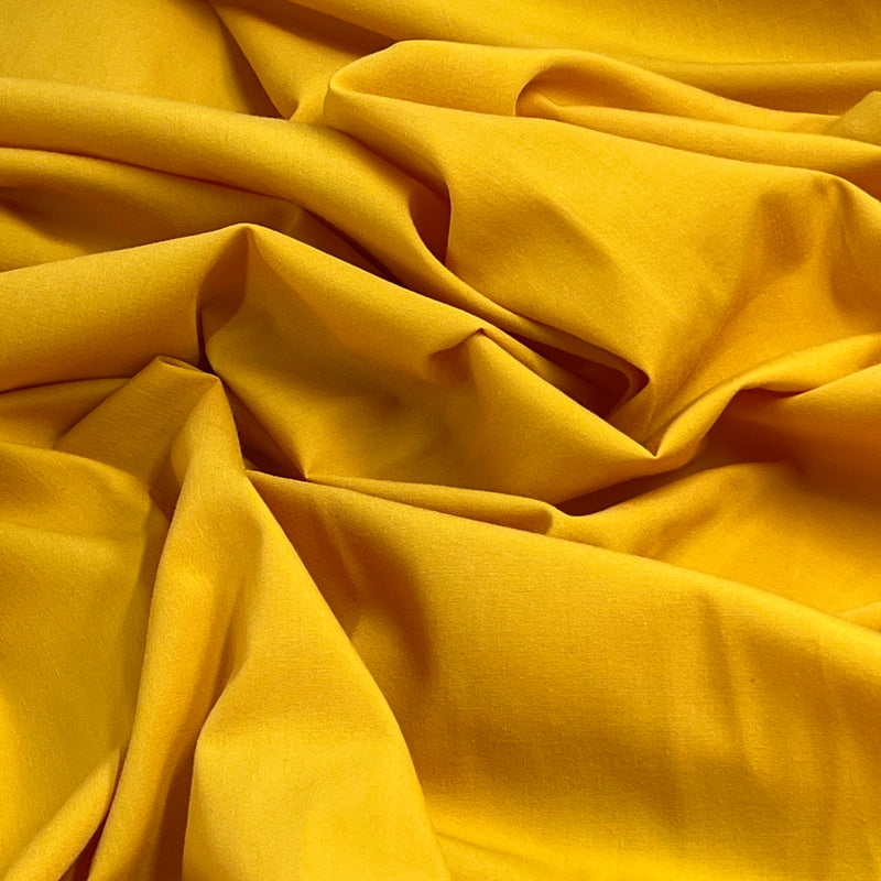 Close-up of yellow fabric with folds