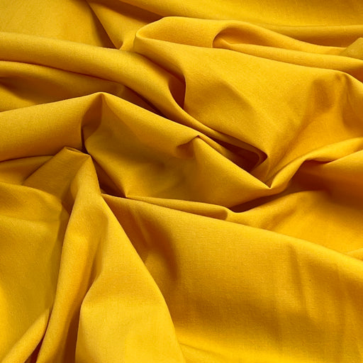 Close-up of yellow fabric with folds