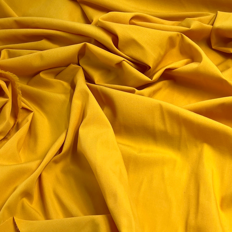 Close-up of yellow fabric with folds
