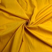 Close-up of yellow fabric with folds