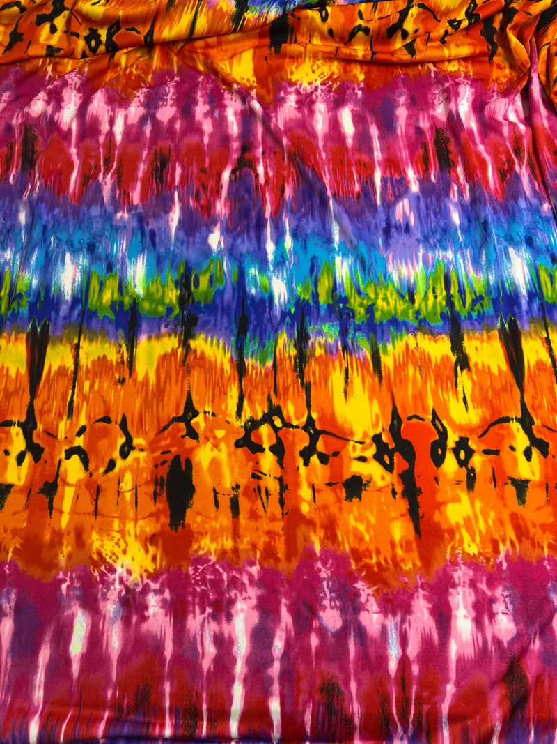 Colorful tie-dye fabric with black abstract patterns