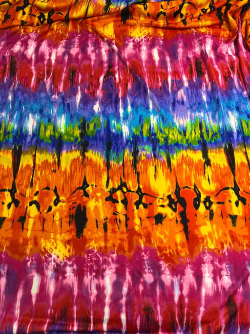 Colorful tie-dye fabric with black abstract patterns