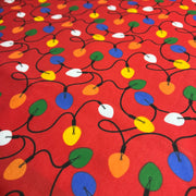 Colorful Christmas light pattern on a red background